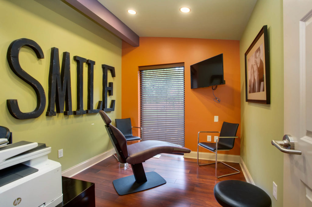 SMILE decorations for dental office on Orange and Green walls