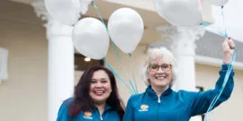 NCOSO Employees smiling with balloons