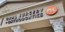 NC Oral Surgery and Orthodontics logo on building