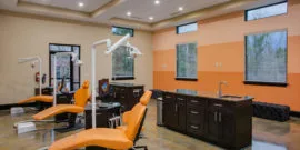 Winston Salem Orthodontist bay with Orange striped wall and orange chairs